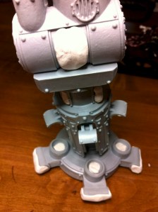 Closeup of reaver titan legs being masked before priming